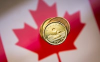 FILE PHOTO: File Photo: A Canadian dollar coin, commonly known as the "Loonie", is pictured in this illustration picture taken in Toronto, January 23, 2015.  REUTERS/Mark Blinch/File Photo/File Photo