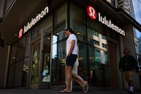 Shoppers pass by a lululemon clothing store in downtown Toronto on May 27, 2026. (Sammy Kogan/The Globe and Mail)