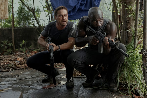 Gerard Butler as Brodie Torrance and Mike Colter as Louis Gaspare  in PLANE. Photo Credit: Kenneth Rexach