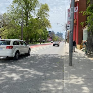 Cars merge into the right lane ahead of the new priority transit lane on Bathurst Street, just south of Dundas Street in Toronto on May 22, 2026. Experts say using the zipper method can help everyone move faster.