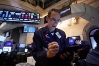 Trader Gregory Rowe works on the floor of the New York Stock Exchange, Monday, July 22.