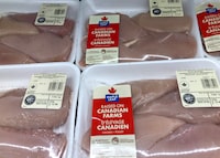 Packages of Maple Leaf Foods chicken breasts are shown on a shelf at a grocery store in Oakville, Ont., Friday, Jan.6, 2023. 