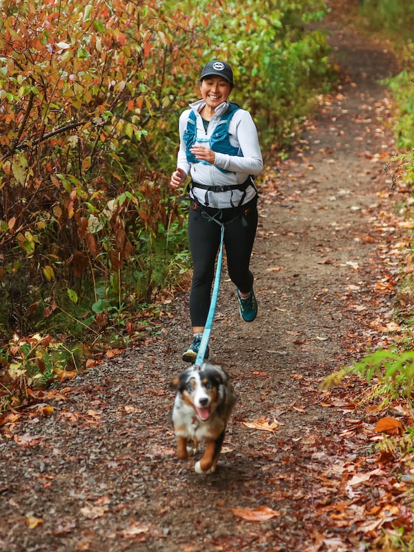 Yuka Koreeda and her dog Jasmine, take part in a canicross morning run in Hamilton, Ont, in October. Canicross is a sport where a human and dog run together as a team, connected by a bungee leash, with the dog pulling the human. 