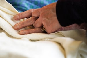 Quebec has adopted a new law expanding access to medical aid in dying by allowing early requests for the procedure. A patient has his hand held in a hospital in Minneapolis, Monday, May 3, 2021. THE CANADIAN PRESS-David Joles-Star Tribune via AP