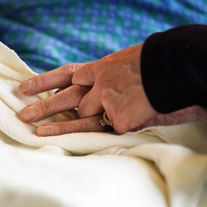 Quebec has adopted a new law expanding access to medical aid in dying by allowing early requests for the procedure. A patient has his hand held in a hospital in Minneapolis, Monday, May 3, 2021. THE CANADIAN PRESS-David Joles-Star Tribune via AP