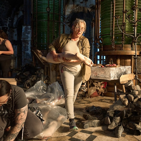 Production Designer Tamara Deverell with crew members on the set of Frankenstein.