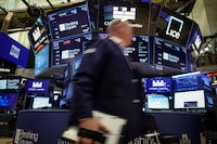 Traders work during the IPO of Pershing Square Inc., on the floor of the New York Stock Exchange (NYSE), in New York City, U.S., April 29.