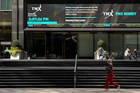 A person walks past the TMX Market Centre in Toronto. Sept. 11, 2024. 