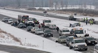 The scene of a multiple car pile up on Highway 416 northbound at Bankfield Dr. just south of Ottawa on Monday Dec. 14, 2009. THE CANADIAN PRESS/Pawel Dwulit