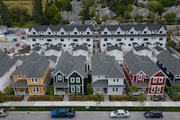 New single family houses billed as estate cottages and townhouses under construction are seen in an aerial view, in Delta, B.C., on Monday, Aug. 12, 2024. THE CANADIAN PRESS/Darryl Dyck