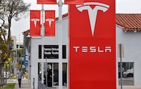 ALHAMBRA, CALIFORNIA - JULY 02: The Tesla logo is displayed at a Tesla dealership on July 2, 2026 in Alhambra, California. Tesla stock closed the trading day down 7.5 percent despite a strong quarterly deliveries report from the electric vehicle (EV) maker. (Photo by Mario Tama/Getty Images)