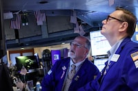 Traders work on the floor at the New York Stock Exchange (NYSE) in New York City, U.S., April 13, 2026.  REUTERS/Brendan McDermid