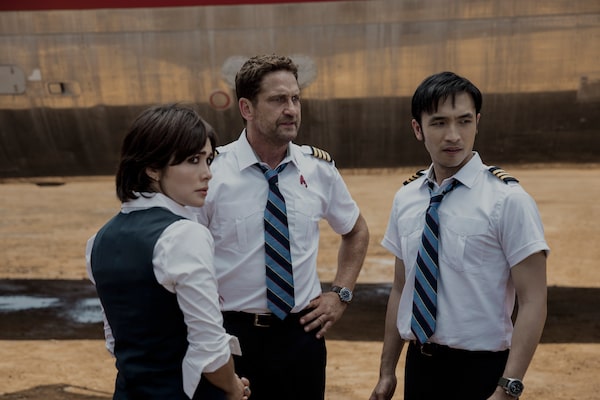 Daniella Pineda as Bonnie Lane, Gerard Butler as Brodie Torrance, and Yoson An as Samuel Dele in PLANE. Photo Credit: Kenneth Rexach