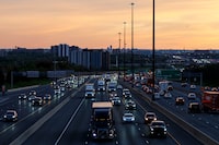 Trucks are seen in from Keele St. driving along the 401 in Toronto on Wednesday, May 20, 2026
(Keito Newman/The Globe and Mail)

