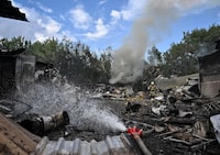 Rescuers work at a site of a Russian air strike, amid Russia's attack on Ukraine, in Zaporizhzhia, Ukraine July 8, 2026. REUTERS/Stringer     TPX IMAGES OF THE DAY