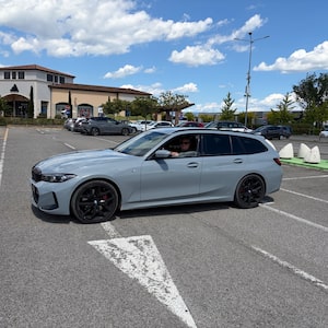 Andrew Clark behind the wheel of his rented BMW 3 Series wagon in Italy.