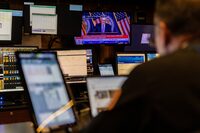 A trader works inside a booth, as screens display a news conference by Federal Reserve Board Chairman Jerome Powell following the Fed rate announcement, on the floor of the New York Stock Exchange (NYSE) in New York City, U.S., May 1, 2024. REUTERS/Stefan Jeremiah/File Photo