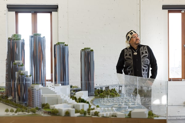 Chair of the Squamish Nation’s governing council, Wilson Williams, with a model of the full Sen̓áḵw development. January 20, 2026.