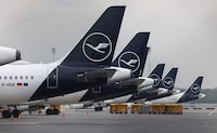 (FILES) Planes of German airline Lufthansa sit on the tarmac on April 13, 2026 at Munich's international airport, as hundreds of Lufthansa flights were cancelled in Germany as pilots kicked off a strike over pay and pensions, the latest walkout at the German aviation giant this year. The pilots' union for Lufthansa, Europe's biggest air transport group, on April 14, 2026 called for another two-day strike in Germany over a salary and pensions dispute. (Photo by Alexandra BEIER / AFP via Getty Images)