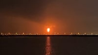This frame grab from AFPTV video footage on June 21, 2026, shows an explosion at Qatar's Ras Laffan industrial zone, home to the world's largest liquefied natural gas hub, as the result of a "technical incident", the interior ministry says. An explosion at a factory in Qatar injured 54 people and left 18 missing, the Gulf state's interior ministry said on June 22, 2026. A "technical incident" caused the blast on June 21, 2026 in Qatar's Ras Laffan industrial zone, the ministry said, adding that authorities were searching for the missing. State-owned firm QatarEnergy said the blast occurred "during the start-up of operations at Ras Laffan Industrial City, which resulted in an explosion and fire at Barzan local gas supply facility". (Photo by AFPTV / AFP via Getty Images)