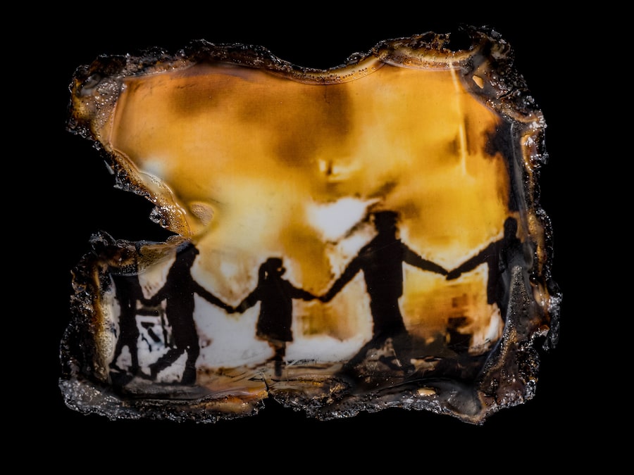 Iranians gather around a bonfire amid anti-government protests as they chant, “You’re the pervert. You’re the whore. I’m a free woman” on the streets in Iran in 2022.