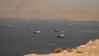 FILE PHOTO: Vessels at the Strait of Hormuz, as seen from Musandam, Oman, June 18, 2026. REUTERS/Stringer//File Photo