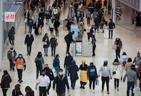 People navigate through Yorkdale Mall in search of Black Friday sales in Toronto on November 26, 2021. When Shopify Inc.'s Harley Finkelstein surveys November's retail landscape, he finds it hard to see where Black Friday stops and Cyber Monday begins. The annual pre-holiday sales blitzes meant to encourage customers to drop cash on discounted goods have bled together in recent years, with stores extending Black Friday promotions beyond a single day and online retailers offering Cyber Monday deals all week -- or all month. THE CANADIAN PRESS/Tijana Martin