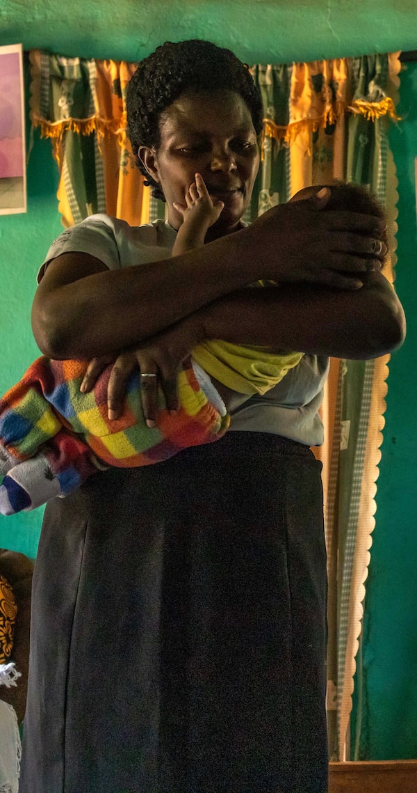  Health volunteer Christine Mubangizi, checking on a new mother and baby in southwestern Uganda, has spent years helping girls manage parenthood and make their way back to school.