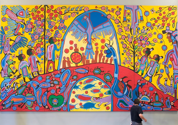 A worker installs Canadian Aboriginal artist Norval Morrisseau's painting "Androgyny" in the ballroom at Rideau Hall Thursday, Sept. 18, 2008 in Ottawa. Measuring 3.66m high and 6.1m wide, "Androgyny" replaces "Charlottetown Revisited", a work created by the Jean Paul Lemieux, which has been on display since 2006. THE CANADIAN PRESS/Adrian Wyld