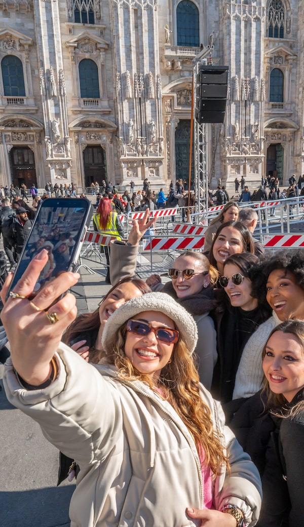 This KIKO makeup team will be busy dolling up performers at the Olympic opening ceremony, but the day before, they have time for some sightseeing at Milan’s Piazza del Duomo, named for its historic cathedral.