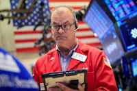 Traders work on the floor at the New York Stock Exchange (NYSE) in New York City, U.S., June 22, 2026 