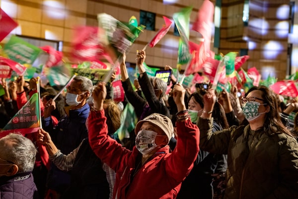 Supporters of Taiwan's Democratic Progressive Party celebrate at an election day rally in Taipei. The party's candidate, Lai Ching-te, won the presidency with around 40 per cent of the vote.