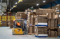 Pallets of cardboard box packaging are prepared for shipping at Cascades in Drummondville, Que., on Friday, March 27, 2026. THE CANADIAN PRESS/Christinne Muschi 
