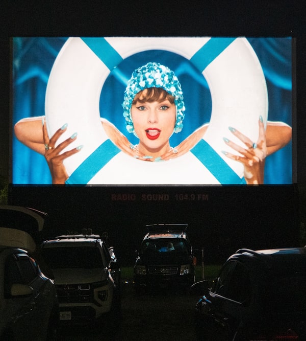 Swifties attend a screening celebrating the release of Taylor Swift’s new album, The Life of a Showgirl, at the Mustang Drive-In Theatre in Guelph, Ont., on Oct. 3.