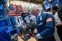 NEW YORK, NEW YORK - MARCH 09: Traders work on the floor of the New York Stock Exchange (NYSE) on March 09, 2026 in New York City. The Dow was down over 700 points in morning trading as global markets continue to react to events in the Middle East. (Photo by Spencer Platt/Getty Images)