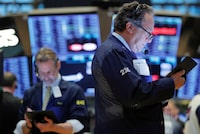 Falling rates also push income investors into the stock market in search of a decent yield, which is why high-dividend sectors are also called “bond proxies.”       FILE PHOTO: Traders work on the floor of the New York Stock Exchange (NYSE) shortly after the opening bell in New York, U.S., March 26, 2019. REUTERS/Lucas Jackson