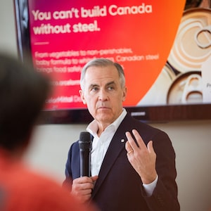 Prime Minister Mark Carney gives remarks at an ArcelorMittal Dofasco facility in Hamilton, Ont., on March 29.