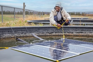 Koami Hayibo, an engineering postdoctoral scholar from Western University, develops wood-based racking for solar panels to replace more costly metal racks.