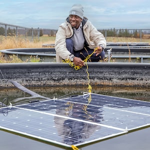 Koami Hayibo, an engineering postdoctoral scholar from Western University, develops wood-based racking for solar panels to replace more costly metal racks.