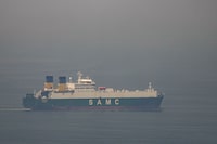 A cargo ship sails in the Arabian Gulf towards Strait of Hormuz in UAE.