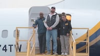 Ryan Wedding, a Canadian former Olympic snowboarder accused of becoming a cocaine smuggling kingpin linked to multiple drug-related murders, is escorted by FBI agents as he arrives handcuffed at Ontario International Airport, in California, U.S., January 23, 2026, in this screengrab taken from video.  FBI/Handout via REUTERS    THIS IMAGE HAS BEEN SUPPLIED BY A THIRD PARTY     TPX IMAGES OF THE DAY