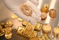 A view of Krugerrand coins and Gold bars kept in the safe deposit boxes room of the Pro Aurum gold house in Munich, Germany, January 10, 2025.