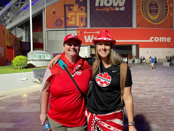 Canada fans Deanna Smith and Dina Dods-Brookes pose outside the Khalifa International Stadium in Doha, Qatar.