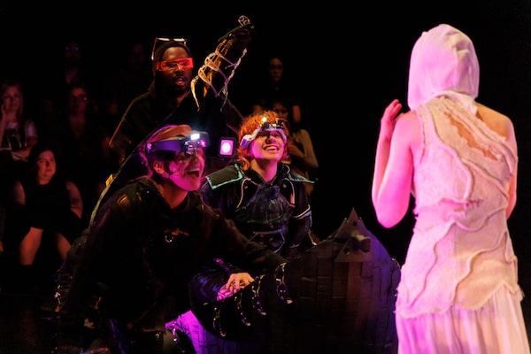 Performers Sofía Rodríguez, Danté Prince, Amy Keating form a group across form creator/performer Devon Healey in a production still from the theatrical staging of Rainbow on Mars. A new performance directed by Mitchell Cushman and Nate Bitton.