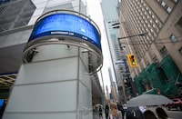 An electronic stock ticker in Toronto's Financial District. S&P Dow Jones Indices said any TSX-listed company will be eligible for inclusion in S&P/TSX indexes as a 'foreign issuer' if it has a 'meaningful presence and/or economic exposure to Canada.'