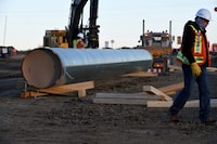 Pipeline being moved in Acheson, Alberta, in 2019.