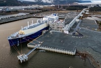Wudang, a liquefied natural gas (LNG) tanker, fills up at an LNG Canada facility, in an aerial view, in Kitimat, B.C., on Thursday, November 13, 2025. THE CANADIAN PRESS/Ethan Cairns