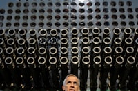 Canada's Prime Minister Mark Carney and Ontario Premier Doug Ford hold a joint press conference in front of a mock nuclear reactor at the Darlington Energy Complex in Courtice, Ontario, Canada, October 23, 2025. 