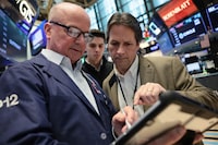 NEW YORK, NEW YORK - APRIL 20: Traders work on the floor of the New York Stock Exchange during morning trading on April 20, 2026 in New York City. Stocks opened up mixed as investors continue to monitor the U.S. war with Iran after an escalation over the weekend due to the seizure of an Iranian-flagged cargo ship. (Photo by Michael M. Santiago/Getty Images)