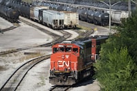 A CN locomotive sits idle at the CN Stuart Yard west of the West Harbour GO station in Hamilton, Ont., Thursday, Aug. 22, 2024.
